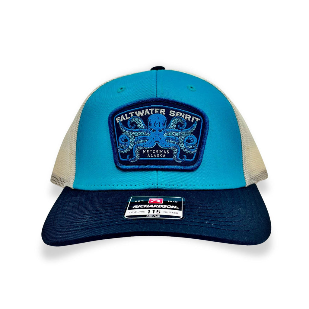 Blue and navy cap with a patch on a white background